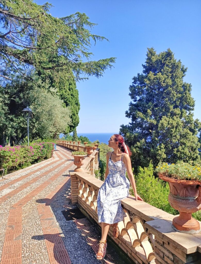 the villa comunale gardens in taormina with view of the sea and flowers and trees