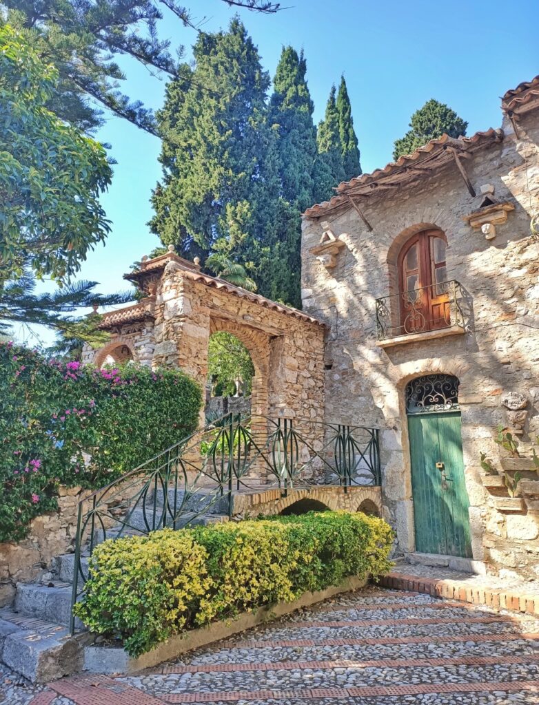 rustic building with trees in taormina sicily