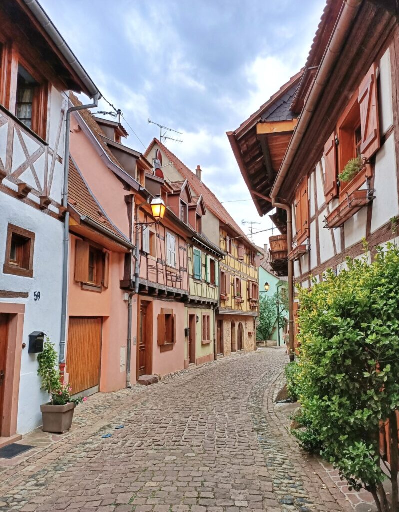 a small medieval street in Eguisheim, France