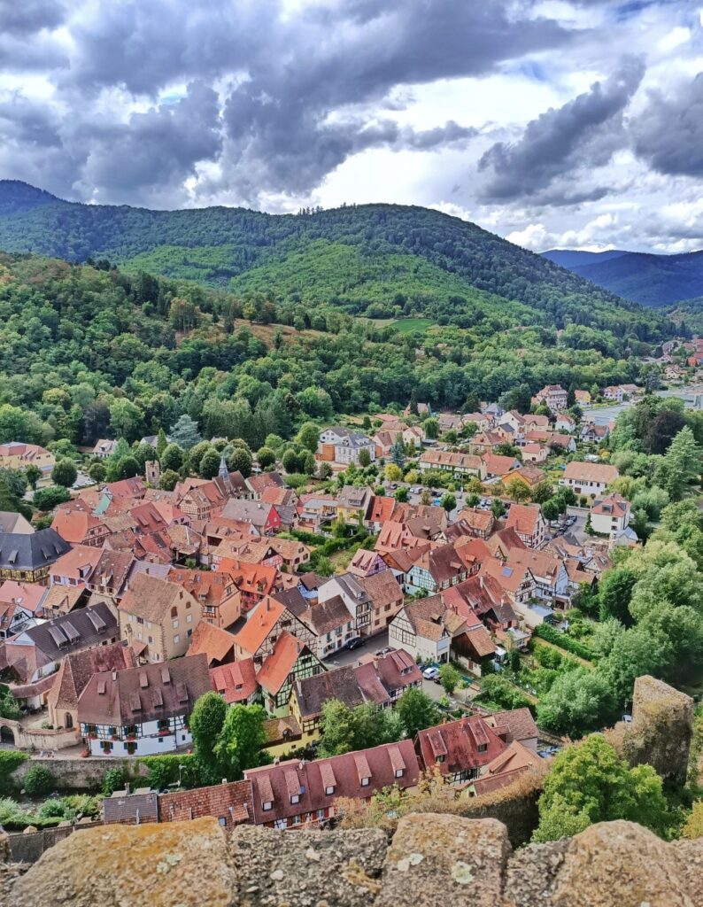 a panoramic view of Kayserberg, France with medieval houses from the castle tower